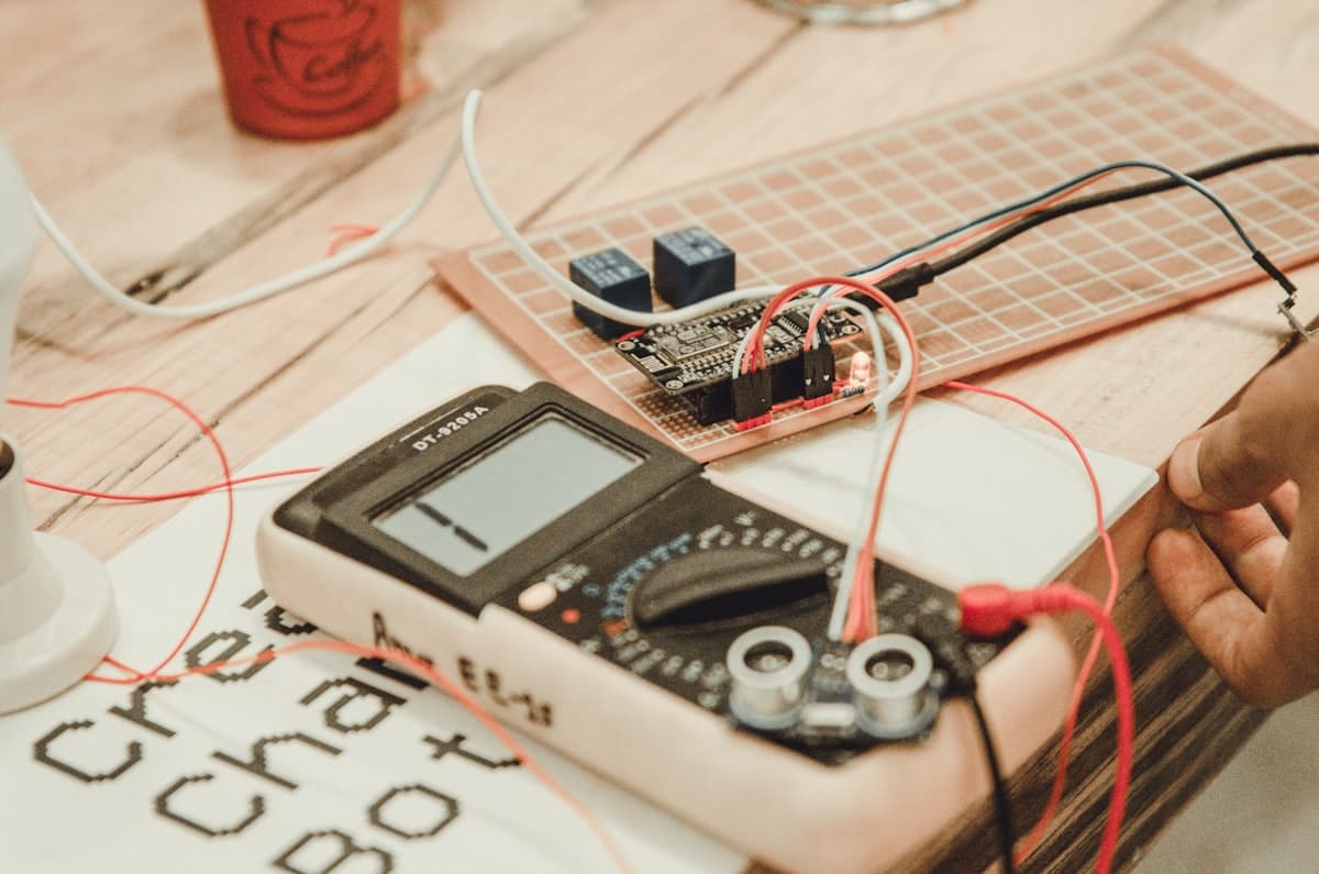 Portable test instrument and test leads set up on a bench